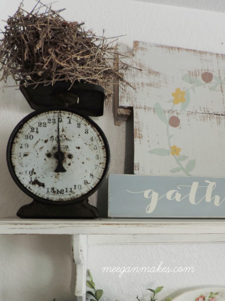 Vintage Scale and Birds Nest on Open Shelves