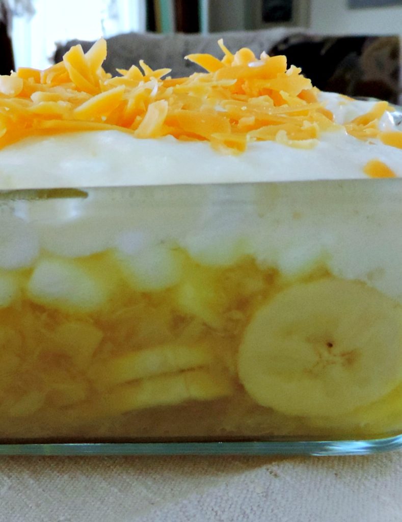 festive-lemon-jello-topped-with-whipped-cream-and-sharp-cheddar-cheese-delicious